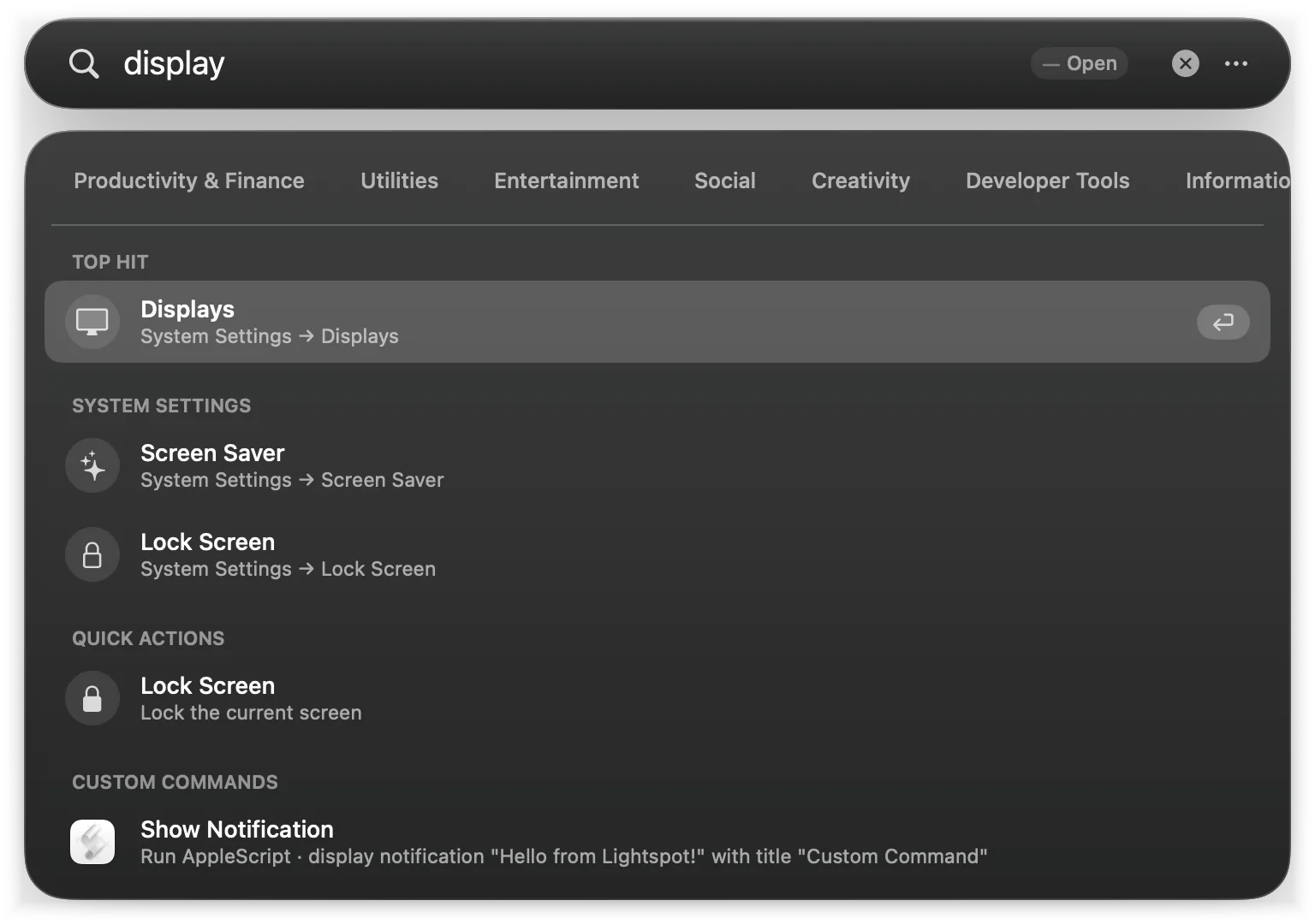 Typing display: Displays as Top Hit, then Screen Saver and Lock Screen panes, a quick action and a custom command
